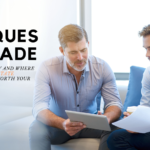 A group of people looking at a computer Description automatically generated