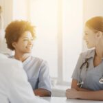 A doctor talking to a patient Description automatically generated with medium confidence