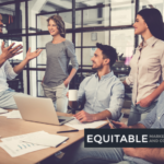 A group of people sitting around a table Description automatically generated with medium confidence