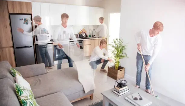 Montage of the same man cleaning a modern open-plan living room and kitchen: vacuuming, dusting, wiping counters, sweeping, and tending a plant.